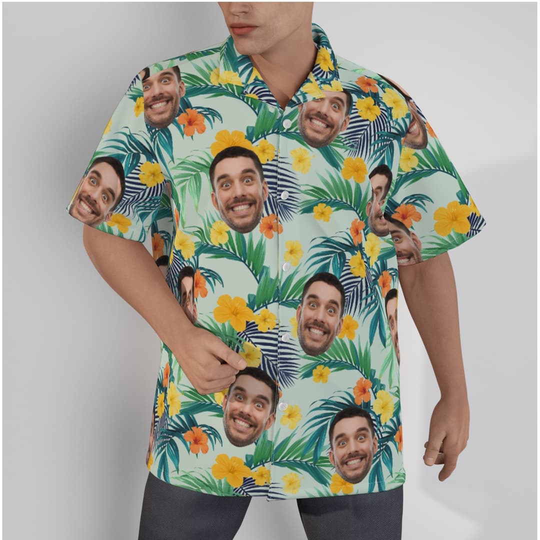 A Button Up Hawaiian Shirt for Men with design of a light green with Areca Palm Leaves and Vibrant Yellow and Orange Hibiscus.